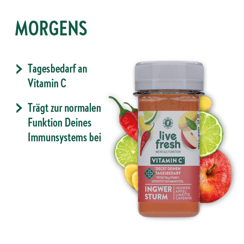 „LiveFresh Immun Shot“ mit der Geschmacksrichtung „Ingwer Sturm“, der morgens eingenommen werden soll. Der Shot deckt den Tagesbedarf an Vitamin C und trägt zur normalen Funktion des Immunsystems bei. Die Flasche wird von Zutaten wie Ingwer, Apfel, Limette, Cayenne und Zitronenscheiben umgeben, was die natürlichen Inhaltsstoffe des Shots betont.