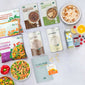 Verschiedene Produkte einer 7-Tage-Food-Kur von LiveFresh, darunter Fertiggerichte, Trinkmahlzeiten, Porridge, Säfte und Vitamine. Daneben liegen Zitronen, Himbeeren, Blaubeeren und Paprika. Unten in der Mitte ist ein Foodkurguide abgebildet. 