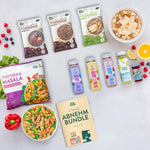 Live Fresh Abnehmbundle mit Porridge-Beuteln, Skyr Drinks und Saft-Flaschen, veganem Tikka Masala, Obst, Müslischale und „4 Tage Abnehmbundle“ Guide.