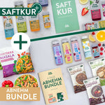 Live Fresh Abnehmbundle mit Saftkur, Porridge-Beuteln, Skyr Drinks, Tikka Masala, Obst, Müslischale und „4 Tage Abnehmbundle“ Guide auf hellem Hintergrund. 